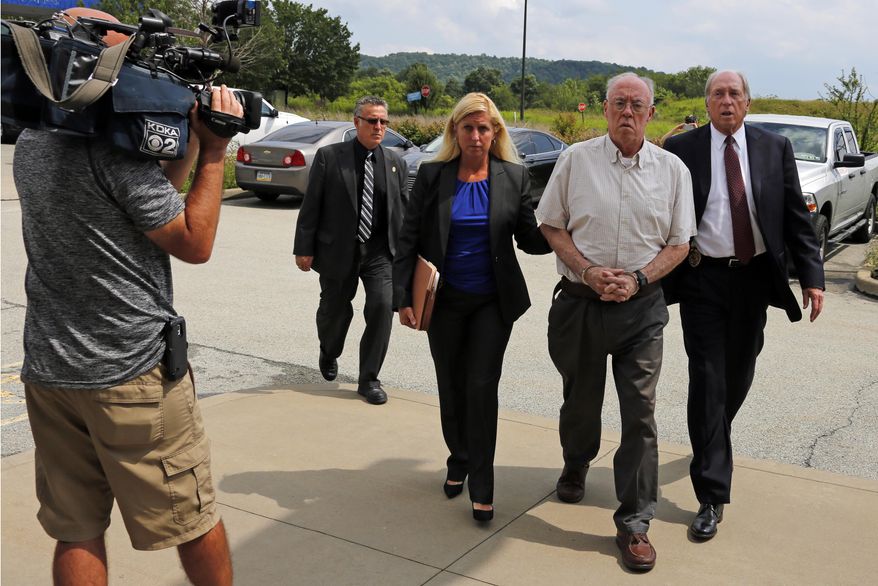 Rev. John T. Sweeney, of Greensburg, Pa., second from right, arrives for an appearance before District Judge Cheryl J. Peck-Yakopec, in Leechburg, Pa., Monday, July 24, 2017. Pennsylvania Attorney General Josh Shapiro announced that Sweeney was arrested today and charged with involuntary sexual intercourse, a first-degree felony, for a sexual assault committed against a 10-year-old boy. (AP Photo/Gene J. Puskar)