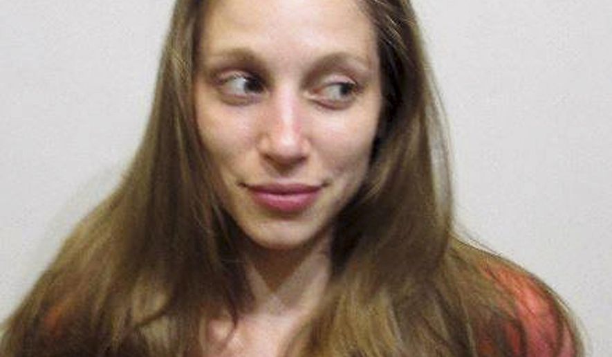This booking photo released by the Rochester, N.H., Police Department on its Facebook page shows Joanne Shaw, charged with attempting to kidnap a baby girl from a vehicle Saturday, July 22, 2017, after the child's father stopped to offer her a ride. (Rochester Police Department via AP)