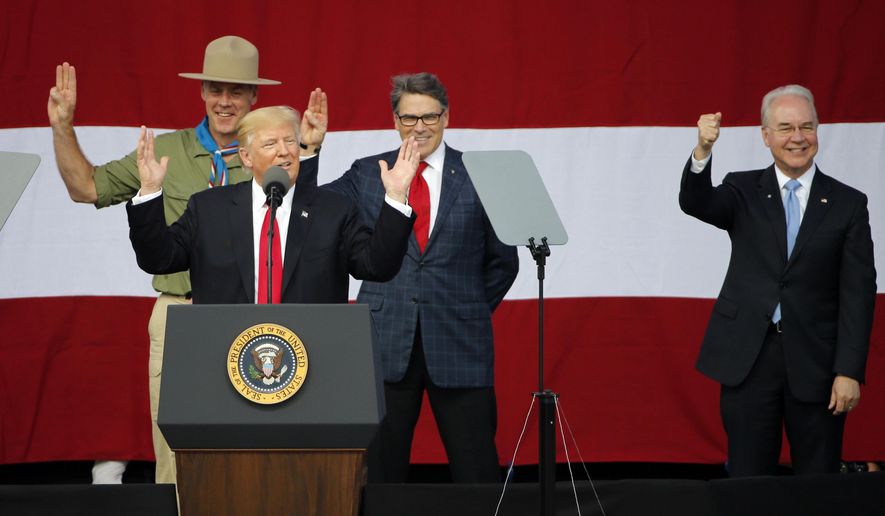 President Donald Trump, front left, gestures with former boys scouts, Interior Secretary Ryan Zinke, left, Energy Secretary Rick Perry, center, and Secretary of Health and Human Services Tom Price, right, at the 2017 National Boy Scout Jamboree at the Summit in Glen Jean,W. Va., Monday, July 24, 2017. (AP Photo/Steve Helber)