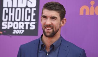 In this July 13, 2017, file photo, retired Olympic swimmer Michael Phelps arrives at the Kids&#39; Choice Sports Awards at UCLA&#39;s Pauley Pavilion in Los Angeles. Phelps lost to a shark in the Discovery Channel’s Shark Week special “Phelps vs. Shark: Great Gold vs. Great White,&amp;quot; which aired on July 23, 2017. It was billed as a race between Phelps and the predator but much to the disappointment of some Twitter users, Phelps didn’t actually swim in the water next to the shark. (Photo by Richard Shotwell/Invision/AP, File)