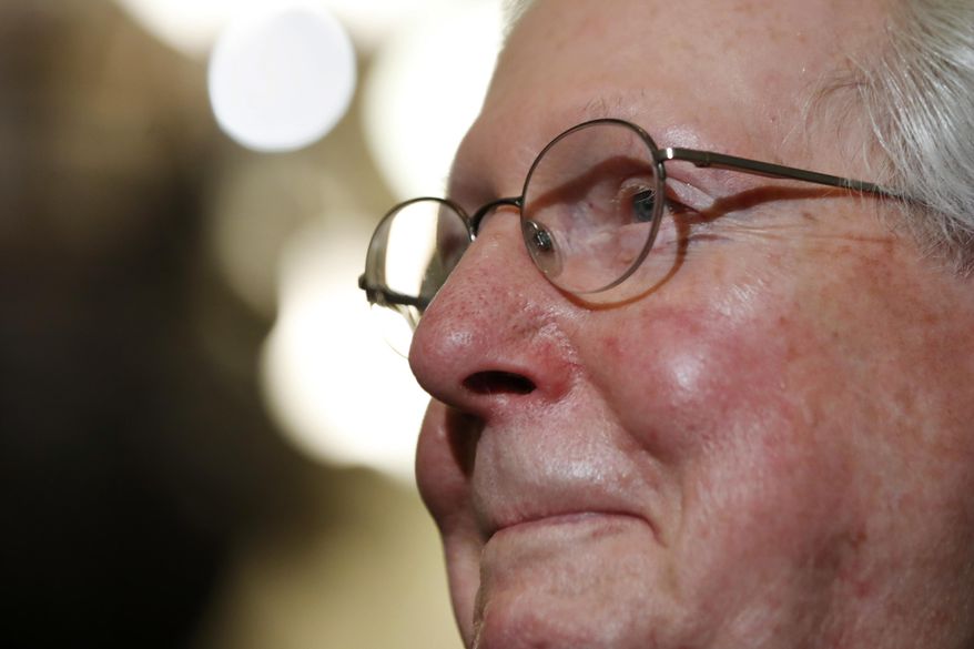 Senate Majority Leader Mitch McConnell of Ky., smiles as he talks to reporters on Capitol Hill in Washington, Tuesday, July 25, 2017, after Vice President Mike Pence broke a 50-50 tie to start debating Republican legislation to tear down much of the Obama health care law. (AP Photo/Jacquelyn Martin)