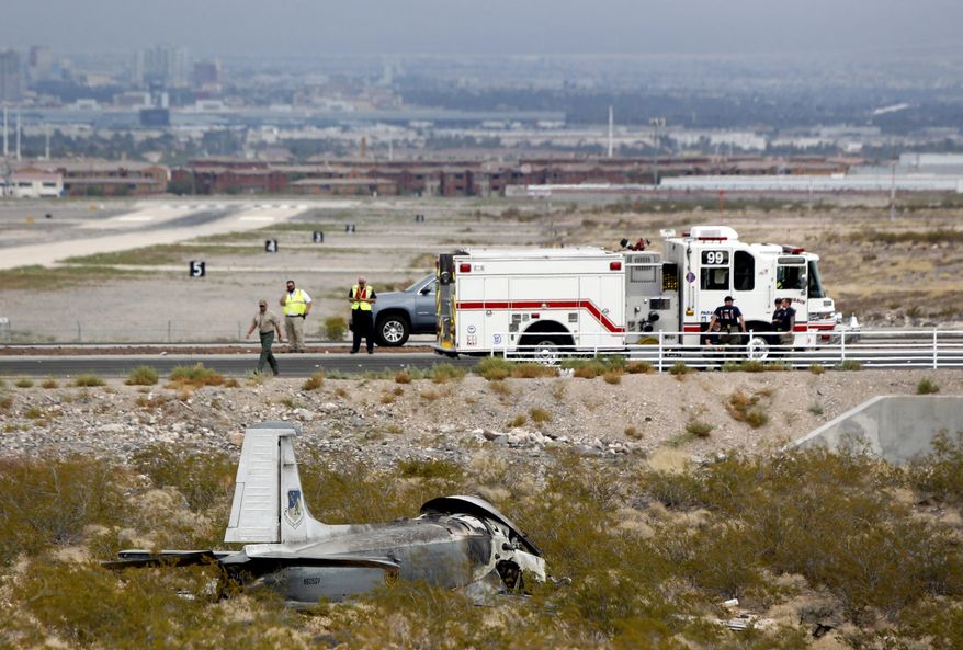 The wreckage of a vintage single-engine British-built military jet is shown after it crashed and burned in the desert just after takeoff from the Henderson Executive Airport in Henderson, Nev., Monday, July 24, 2017. The pilot escaped serious injury, authorities said. (Steve Marcus/Las Vegas Sun via AP)