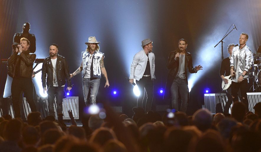 FILE - In this April 2, 2017 file photo, Tyler Hubbard, from right, and Brian Kelley, third from left, of Florida Georgia Line, and from left, Nick Carter, AJ McLean, Brian Littrell, and Kevin Richardson, of Backstreet Boys, perform at the 52nd annual Academy of Country Music Awards in Las Vegas. Backstreet Boys got their first hit country song this year on a collaboration with country duo Florida Georgia Line and now the two powerhouse acts are teaming up for a “CMT Crossroads” episode airing Aug. 30. (Photo by Chris Pizzello/Invision/AP, File)
