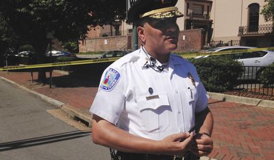 Richmond Police Chief Alfred Durham addresses reporters near the scene of a shooting in the city&#x27;s downtown, Tuesday, July 25, 2917, in Richmond, Va. Durham said police shot and killed a man carrying an ax and a knife. Durham said one officer was hit in what appears to be friendly fire, but Durham said the officer&#x27;s body armor prevented him from being seriously injured. (AP Photo/Alanna Durkin Richer)