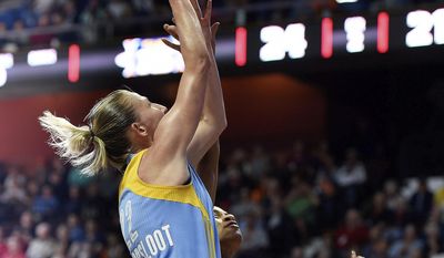 Chicago Sky guard Courtney Vandersloot scores over Connecticut Sun guard Jasmine Thomas during the first half of a WNBA basketball game Tuesday, July 25, 2017, in Uncasville, Conn. (Sean D. Elliot/The Day via AP)