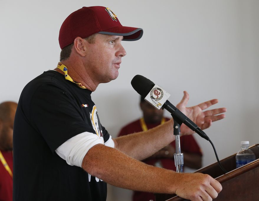 Washington Redskins head coach Jay Gruden gestures during a news conference at the start of NFL football training camp in Richmond,. Va., Wednesday, July 26, 2017. (AP Photo/Steve Helber)