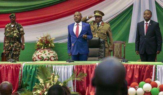 FILE - In this Thursday, Aug. 20, 2015 file photo, Burundi&#x27;s President Pierre Nkurunziza is sworn in for a third term at a ceremony in the parliament in Bujumbura, Burundi. Hundreds of people have been killed and hundreds of thousands have fled the small East African nation in the two years since President Pierre Nkurunziza set off protests by declaring he would seek another term. (AP Photo/Gildas Ngingo, File)