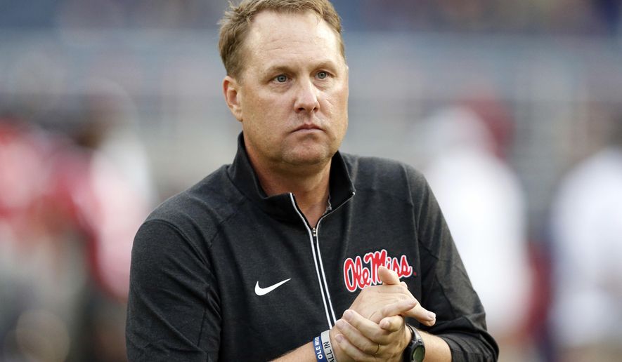 FILE - In this Oct. 24, 2015, file photo, Mississippi football coach Hugh Freeze watches his team warmup before an NCAA college football game against Texas A&M in Oxford, Miss. USA Today reported July 25, 2017, that a charity foundation founded by Freeze is taking a break from fundraising and will reconsider its future days after the coach resigned amid what the school called a "pattern of personal misconduct." (AP Photo/Rogelio V. Solis, File)