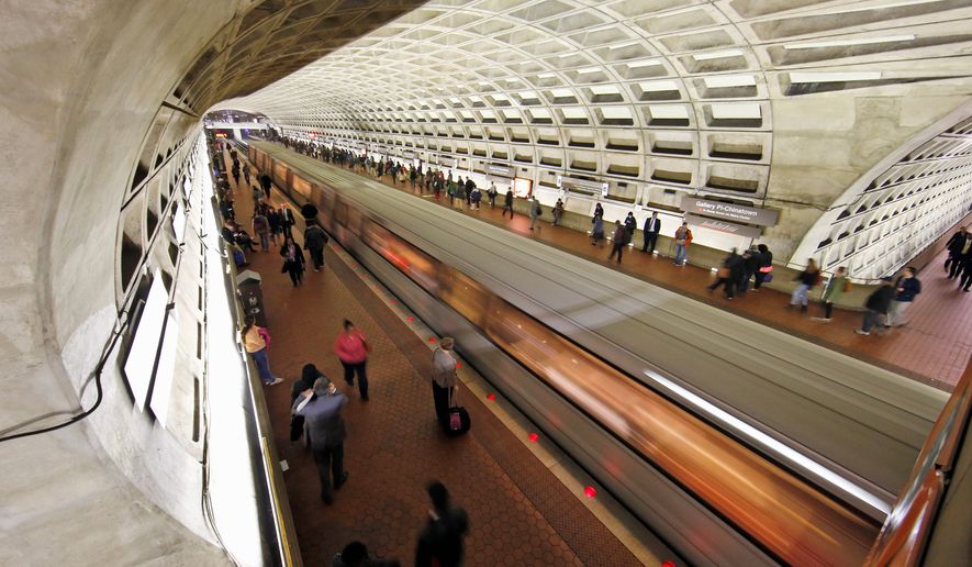 A Metro train departs the Gallery Place-Chinatown Metro station in Washington on March 15, 2016. (Associated Press) **FILE**