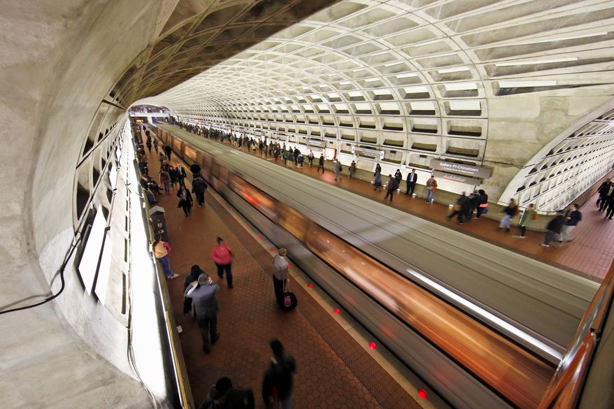 A Metro train departs the Gallery Place-Chinatown Metro station in Washington on March 15, 2016. (Associated Press) **FILE**
