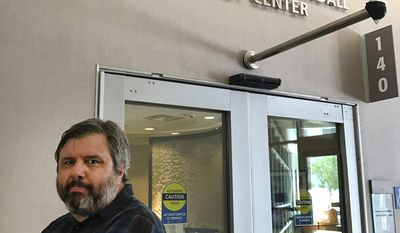 This July 13, 2017 photo provided by Lisa Granados shows Associated Press reporter Andrew Dalton standing outside the Jim and Eleanor Randall Breast Center in Pasadena, Calif. Dalton described his experience as the rare man who underwent a mammogram in a story for the AP. (Lisa Granados via AP)
