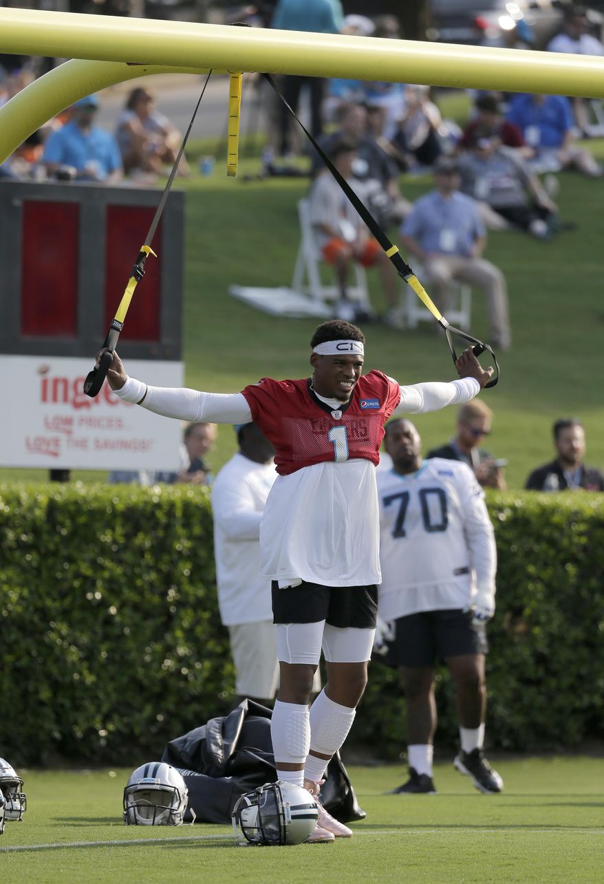 Carolina Panthers' Cam Newton (1) stretches during practice at training camp at Wofford College in Spartanburg, S.C., Wednesday, July 26, 2017. (AP Photo/Chuck Burton)