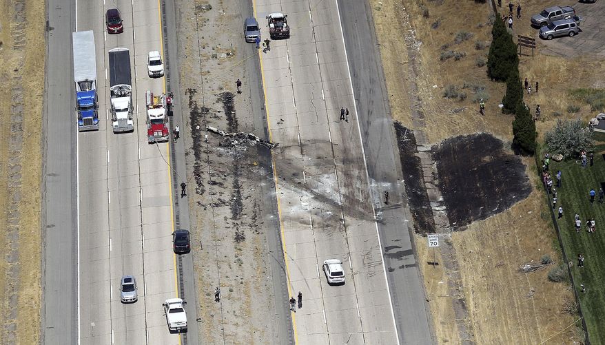 A small plane crashed after it took off from a nearby municipal airport on Interstate 15 in Riverdale, Utah, about 35 miles north of Salt Lake City, Wednesday, July 26, 2017. Authorities say several people died when the plane crashed on a northern Utah interstate median, tangling traffic and leaving blackened wreckage on the highway. (Kristin Murphy/The Deseret News via AP)