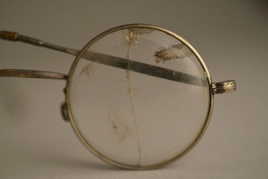 This photo made available by the Aushwitz Museum on Wednesday, July 26, 2017 shows a pair of glasses that once belonged to a person who perished at the Nazi German death camp. Officials at the museum of the Nazi German death camp of Auschwitz say some exhibits are going on a tour of Europe and North America to bring its tragic truth about the Holocaust to a wider audience. The museum said Wednesday this will be its first-ever traveling exhibition and will include some 600 items. The "Not long ago: Not far away" exhibit will include personal items of the victims and a German freight wagon the Nazis used to bring inmates in. (Pawel Sawicki/Aushwitz Museum via AP)