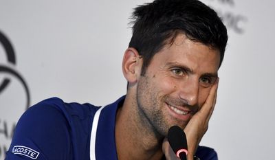 Tennis player Novak Djokovic smiles during a press conference in Belgrade, Serbia, Wednesday, July 26, 2017.  Djokovic will sit out the rest of this season because of an injured right elbow, meaning he will miss the U.S. Open and end his streak of participating in 51 consecutive Grand Slam tournaments. (Andrej Isakovic, Pool Photo via AP)