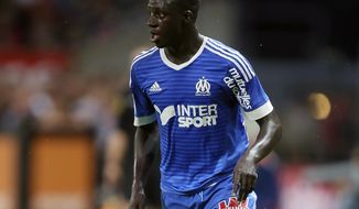 FILE - In this Friday, Aug. 28, 2015 file photo, Marseille&#39;s defender Benjamin Mendy controls the ball during their French League One soccer match against Guingamp at the Roudourou stadium in Guingamp, western France. Manchester City has announced on Monday, July 24, 2017 the signing of left-back Benjamin Mendy from Monaco. The 23-year-old Frenchman was part of the Monaco team which won last season’s French title and knocked out City on its way to the Champions League semifinals. (AP Photo/David Vincent, file)