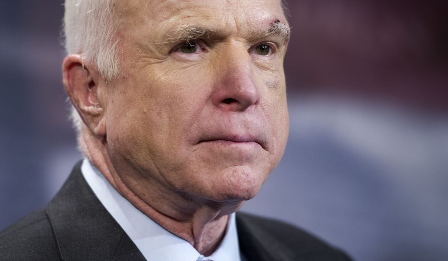 Sen. John McCain, R-Ariz., speaks to reporters on Capitol Hill in Washington, Thursday, July 27, 2017. The Senate voted decisively to approve a new package of stiff financial sanctions against Russia, Iran and North Korea, sending the popular bill to President Donald Trump for his signature after weeks of intense negotiations. The legislation is aimed at punishing Moscow for meddling in the 2016 presidential election and its military aggression in Ukraine and Syria, where the Kremlin has backed President Bashar Assad. McCain said the bills passage was long overdue, a jab at Trump and the GOP-controlled Congress. McCain, chairman of the Armed Services Committee, has called Putin a murderer and a thug.(AP Photo/Cliff Owen)