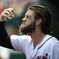 Washington Nationals&#39; Bryce Harper douses himself with water in the dugout before a baseball game against the Milwaukee Brewers, Thursday, July 27, 2017, in Washington. (AP Photo/Nick Wass)