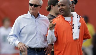 Cleveland Browns owner Jimmy Haslam, left, nS coach Hue Jackson talk during practice at the NFL football team&#39;s training camp facility, Thursday, July 27, 2017, in Berea, Ohio. (AP Photo/Tony Dejak)