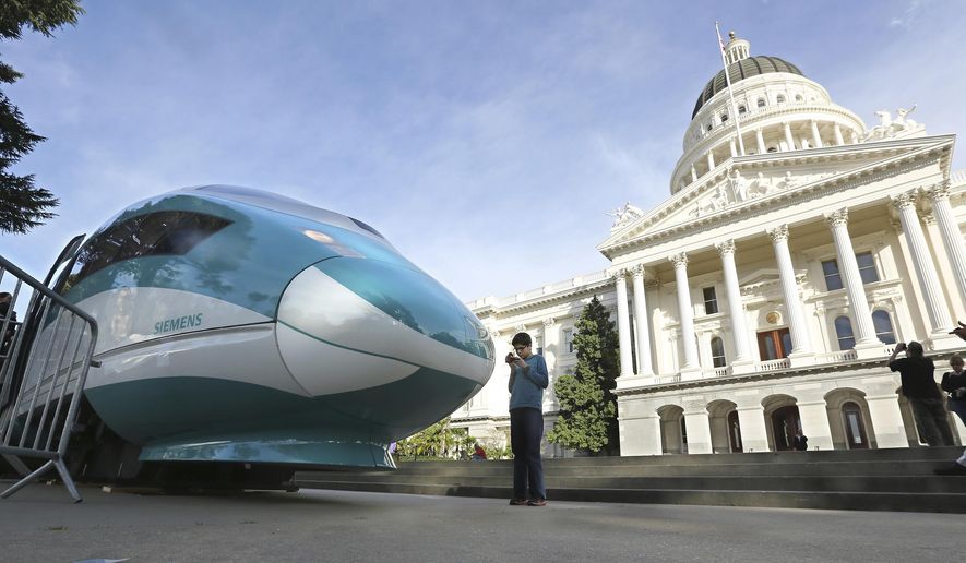 FILE - In this Feb. 26, 2015, file photo, a full-scale mock-up of a high-speed train is displayed at the Capitol in Sacramento, Calif. The California Supreme Court is set to issue a ruling that could have big implications for the state's $64 billion high-speed rail project. The court will decide Thursday, July 27, 2017, whether federal law exempts rail projects such as the planned bullet train between Los Angeles and San Francisco from the state's strict environmental review law known as CEQA. (AP Photo/Rich Pedroncelli, File)