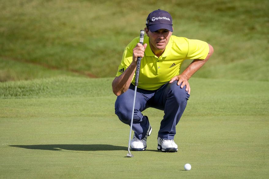 Mike Weir lines up his putt on the sixth green during the Canadian Open Pro-Am golf tournament in Oakville, Ontario, Wednesday July 26, 2017. (David Cooper/The Canadian Press via AP)