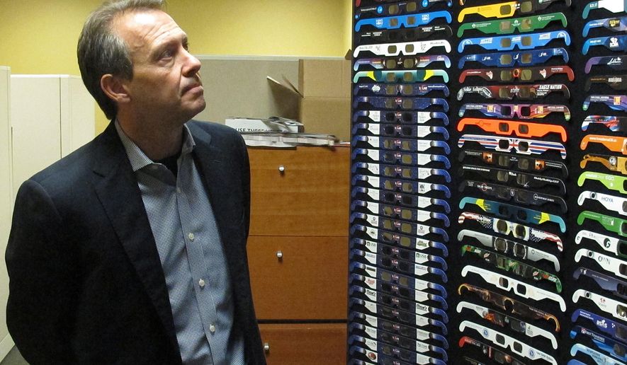 American Paper Optics President and CEO John Jerit looks at a display of solar eclipse glasses in Bartlett, Tenn., on Wednesday, June 21, 2017. Jerit said the company began preparing about two years ago for the August 2017 event. (AP Photo/Adrian Sainz)
