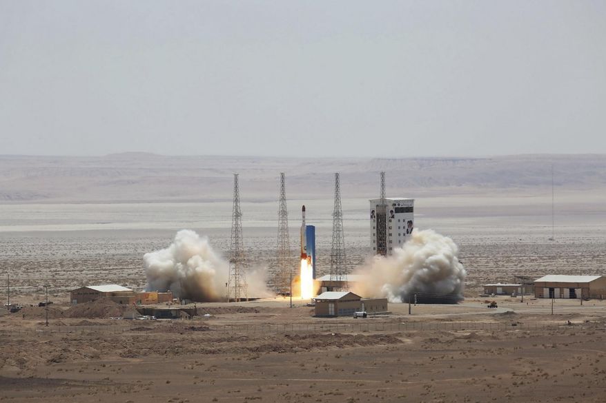 This picture released by the official website of the Iranian Defense Ministry on Thursday, July 27, 2017, claims to show the launching of Simorgh satellite-carrying rocket in an undisclosed location, Iran. (Iranian Defense Ministry via AP)