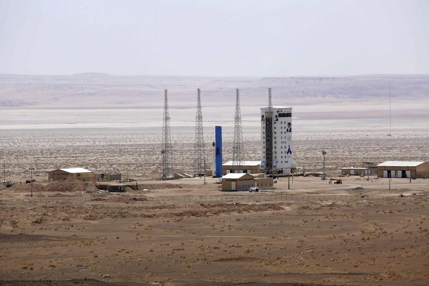 This picture released by the official website of the Iranian Defense Ministry on Thursday, July 27, 2017, claims to show the Simorgh satellite-carrying rocket, center, before being launched into space from Imam Khomeini National Space Center in an undisclosed location, Iran. (Iranian Defense Ministry via AP)