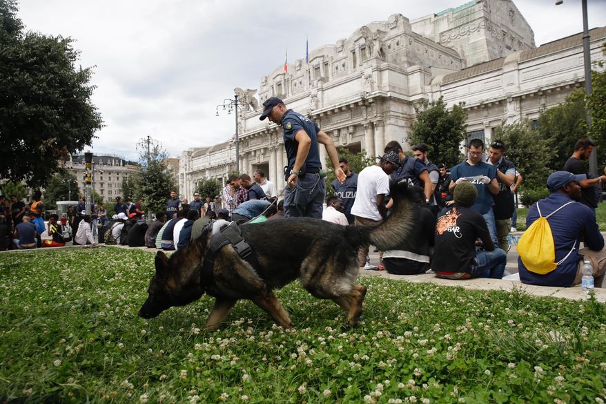 Italian Police check people during a blitz outside Milan’s main train station, Italy, Wednesday, July 26, 2017. Authorities have detained several dozen people in response to an increasing public security issue as the city deals with a new wave of migrants. (AP Photo/Luca Bruno)