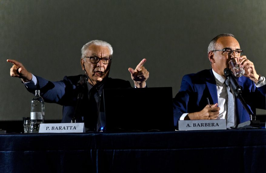 Director of the Venice Film Festival, Alberto Barbera, right, and Venice Biennale President Paolo Baratta unveil the list of participants into the 74th edition of the festival during a press conference in Rome, Thursday, July 27, 2017. The Venice Film Festival will run from Aug. 30 through Sept. 9, 2017, at the Venice Lido. (AP Photo/Domenico Stinellis)