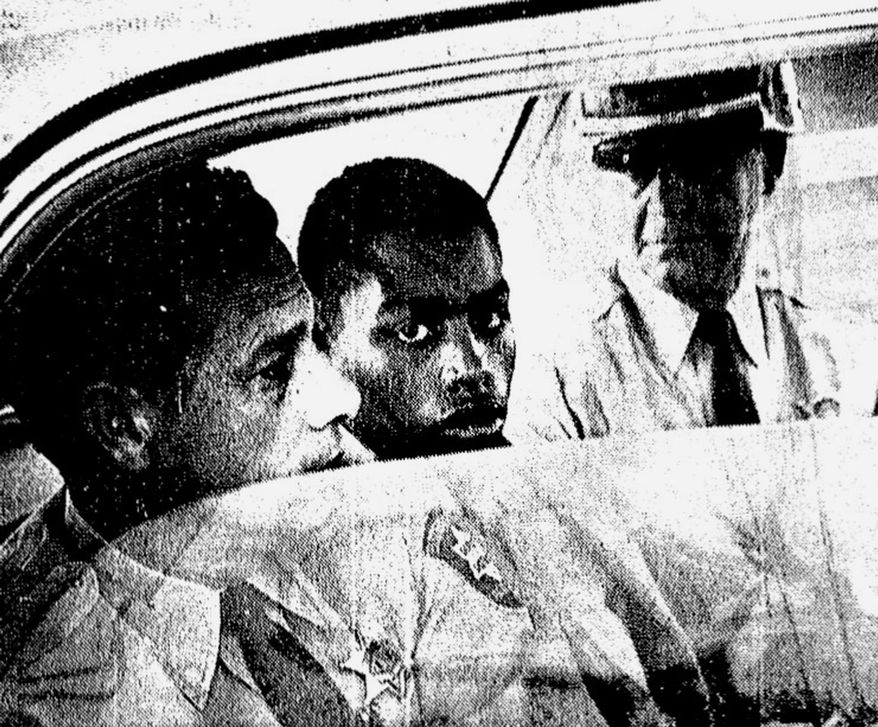 ADVANCE FOR USE MONDAY, JULY 31, 2017 AND THEREAFTER-In this February 1964 photo, Henry Montgomery, flanked by two deputies, awaits the verdict in his trial for the murder of Deputy Sheriff Charles H. Hurt in Louisiana. Montgomery, a 71-year-old prisoner who was 17 when he killed a sheriff's deputy, learned Wednesday, June 21, 2017, that he will get a chance at parole, 54 years after the killing and a year after winning his appeal before the U.S. Supreme Court. (John Boss/The Advocate via AP)