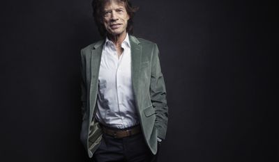 FILE - In this Nov. 14, 2016 file photo, Mick Jagger of the Rolling Stones poses for a portrait in New York. Jagger released the songs and music videos Thursday, July 27, 2017, for tunes titled, “Gotta Get a Grip” and “England Lost.”  (Photo by Victoria Will/Invision/AP)