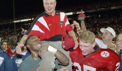 FILE - In this Jan. 1, 1995, file photo, Nebraska players carry coach Tom Osborne off the field after the Huskers defeated Miami 24-17 in the Orange Bowl NCAA college football game in Miami. Osborne is giving up his large skybox at Memorial Stadium, saying the Nebraska athletic department should sell it to someone else rather than have him continue to use it for free. The 80-year-old Osborne coached the Cornhuskers for 25 years, retiring after the 1997 season with 255 wins and all or part of three national championships three of his last four years. He was the school&#39;s athletic director from 2007-12. (AP Photo/Doug Mills, File)