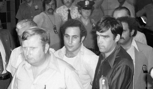 FILE - In this Aug. 11, 1977 file photo, serial killer David Berkowitz, known as "Son of Sam," arrives at Brooklyn Courthouse in New York. A new documentary on the Smithsonian Channel paints a portrait of the fearful, dysfunctional New York City before Berkowitz was captured. (AP Photo/Ira Schwarz, File)