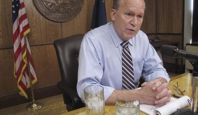 FILE - In this June 8, 2017 file photo, Alaska Gov. Bill Walker meets with reporters in Juneau, Alaska. Walker says he will probably run for re-election but currently has more pressing issues on his mind, including crafting a tax bill that he hopes will garner support from lawmakers, Friday, July 28, 2017. (AP Photo/Becky Bohrer, File)