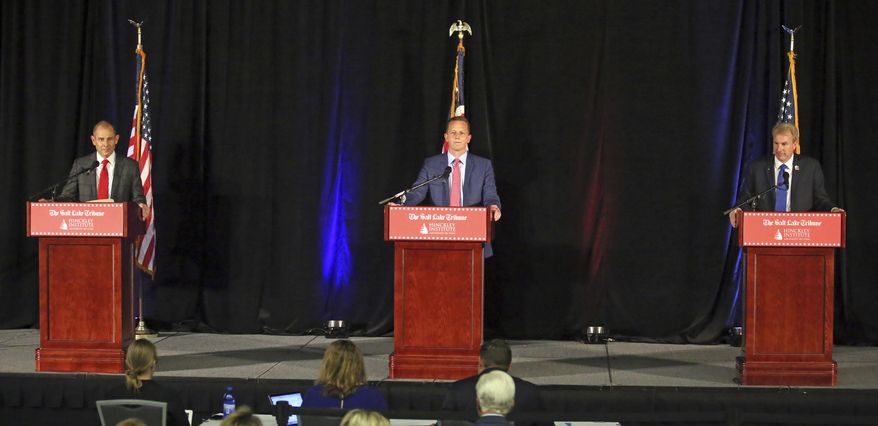Republican candidates John Curtis, left, Tanner Ainge, center, and Chris Herrod, right, participant in a debate at the Utah Valley Convention Center Friday, July 28, 2017, in Provo, Utah. The Republican candidates, vying for the seat vacated by U.S. Rep. Jason Chaffetz, debated on topics ranging from health care to religious freedom. (AP Photo/Rick Bowmer)