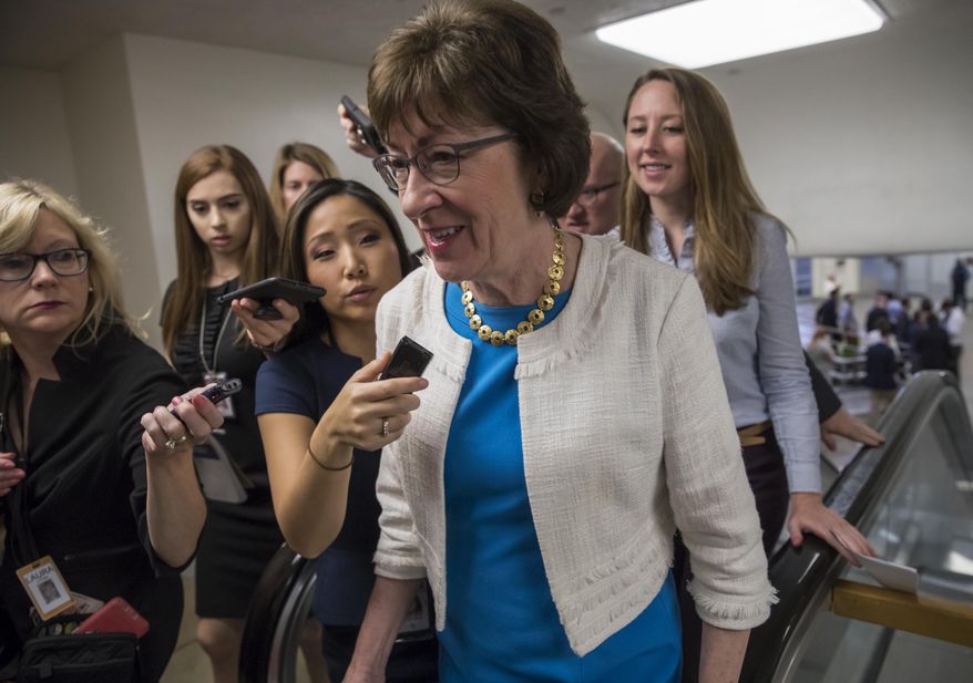 Sen. Susan Collins, R-Maine is surrounded by reporters as she heads to the Senate on Capitol Hill in Washington, Thursday, July 27, 2017, while the Republican majority in Congress remains stymied by their inability to fulfill their political promise to repeal and replace "Obamacare" because of opposition and wavering within the GOP ranks. (AP Photo/J. Scott Applewhite)