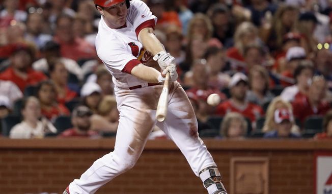 St. Louis Cardinals&#x27; Jedd Gyorko hits an RBI-single during the sixth inning of a baseball game against the Arizona Diamondbacks, Friday, July 28, 2017, in St. Louis. (AP Photo/Jeff Roberson)