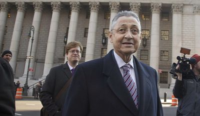 FILE  - In this Wednesday, Nov. 25, 2015 file photo, former New York Assembly Speaker Sheldon Silver, center, leaves court after jurors took a break in Silver&#39;s federal corruption trial in New York. Former New York Assembly Speaker Sheldon Silver’s lawyers say he should not face retrial in his corruption case, at least until the U.S. Supreme Court reviews it. The lawyers say in a Thursday, July 27, 2017 appeals court filing Silver’s case “is an excellent vehicle” for the high court to provide further guidance to lower courts.(AP Photo/Bebeto Matthews, File)