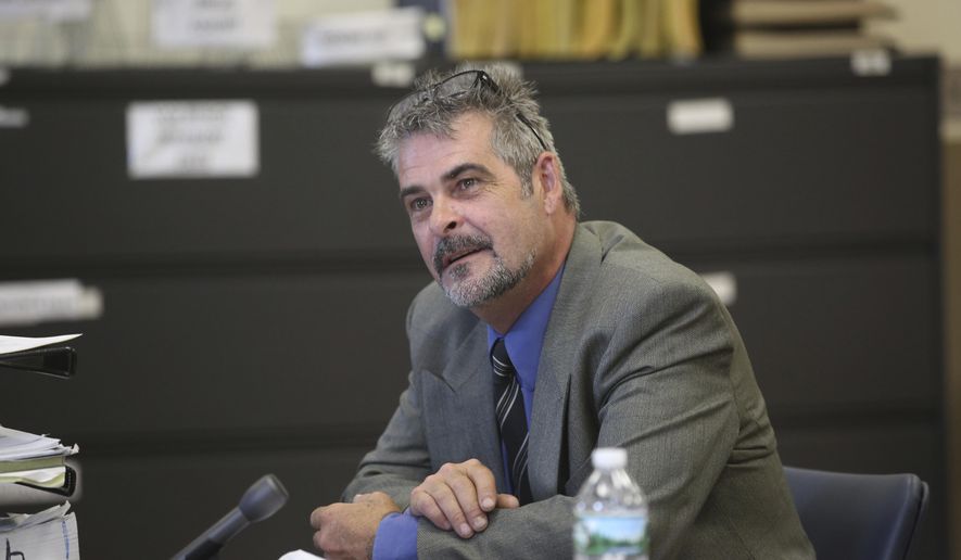 In this Thursday, July 6, 2017 file photo, John Cramsey, who was pulled over outside the Holland Tunnel and found to be carrying a cache of guns last year and charged, listens during a hearing at the Hudson County Courthouse in Jersey City, N.J. Cramsey, a Pennsylvania man arrested last year outside New York City with a vehicle full of weapons for an alleged drug rescue plans to plead guilty. A person with direct knowledge of the case tells The Associated Press John Cramsey will plead guilty Monday, July 31, 2017. (Ed Murray/NJ Advance Media via AP, Pool, File)