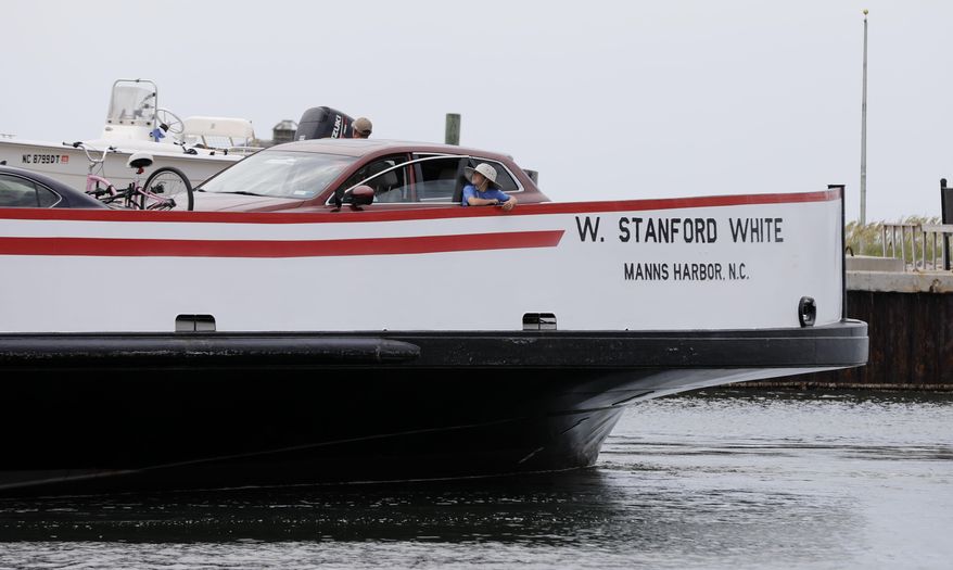 Passengers ride the ferry back from Ocracoke to Hatteras, N.C. Friday July, 28, 2017. A man-made power outage, not an approaching hurricane, forced 10,000 tourists to flee two North Carolina islands and turned summer vacation into a messy nightmare for many. (Ethan Hyman/The News & Observer via AP)