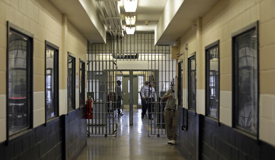 ADVANCE FOR USE WEDNESDAY, AUG. 2, 2017 AND THEREAFTER-This Friday, May 26, 2017 shows a hallway inside the Franklin Correctional Center in Bunn, N.C. A 2016 Supreme Court decision triggering new sentences for inmates serving mandatory life without parole for crimes committed as minors has had a far greater effect: The ruling is prompting lawyers to apply its fundamental logic _ that it's cruel and unusual to lock teens up for life _ to a larger population of prisoners: those whose sentences technically include a parole provision but who stand little chance of getting out. (AP Photo/Gerry Broome)
