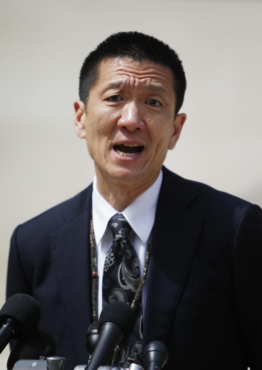 FILE--In this March 15, 2017, file photo, Hawaii Attorney General Douglas Chin speak at a press conference outside the federal courthouse in Honolulu. The top legal officers in 18 states and the District of Columbia have asked Congress to pass legislation prohibiting discrimination against transgender service members with Chin sending the letter dated Thursday, July 27, 2017, in response to President Donald Trump's announcement, via Twitter a day earlier, that he would ban transgender people in the military. (AP Photo/Marco Garcia, file)