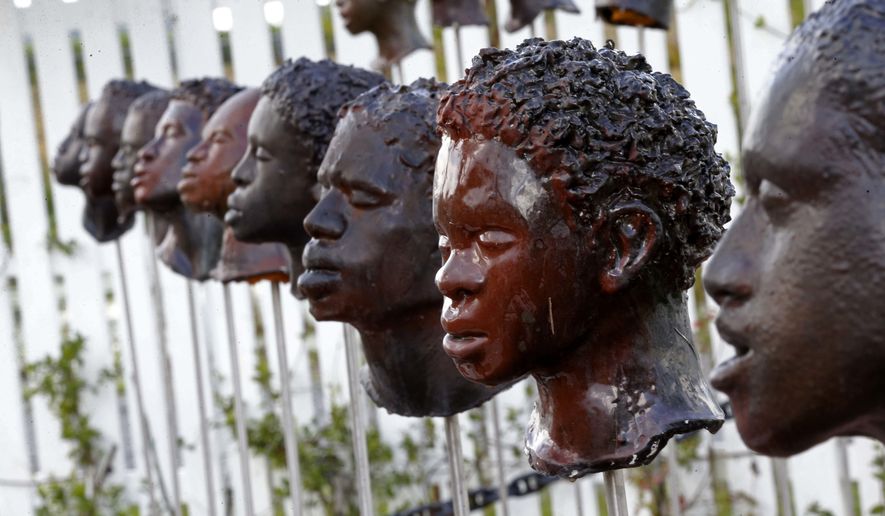 This July 14, 2017 photo shows a memorial by Woodrow Nash for the German Coast Uprising at the Whitney Plantation in Edgard, La. After the uprising, slaves who participated were tried and executed. Their heads were placed in public view along the Mississippi River, to serve as a warning to others. (AP Photo/Gerald Herbert)