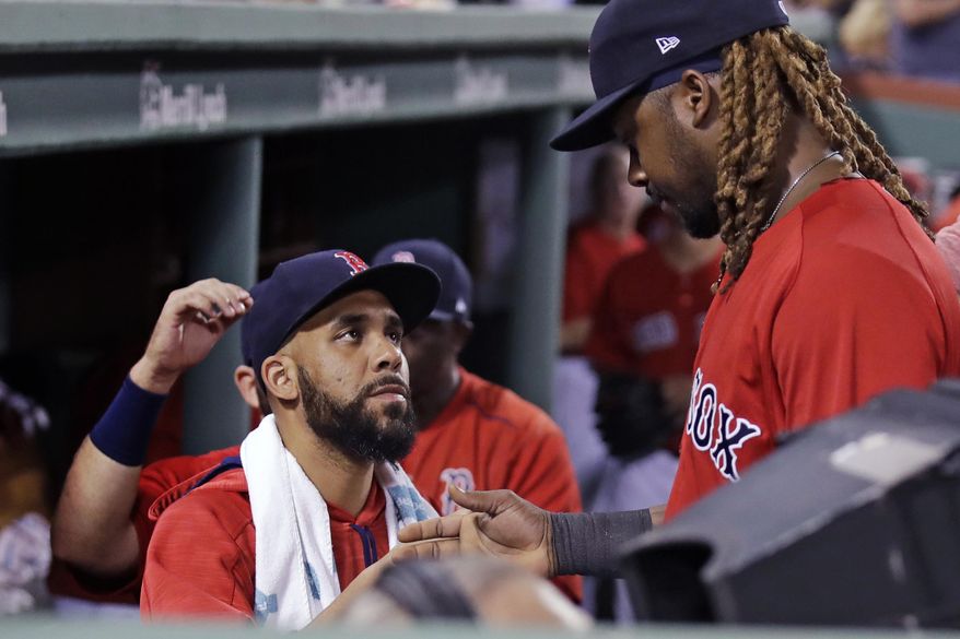 Boston Red Sox starting pitcher David Price, left, congratulates Hanley Ramirez who made the catch on the final out in the fourth inning during a baseball game against the Kansas City Royals at Fenway Park, Friday, July 28, 2017, in Boston. The Red Sox announced that Price was added to the 10-day disabled list prior to the game. (AP Photo/Charles Krupa)