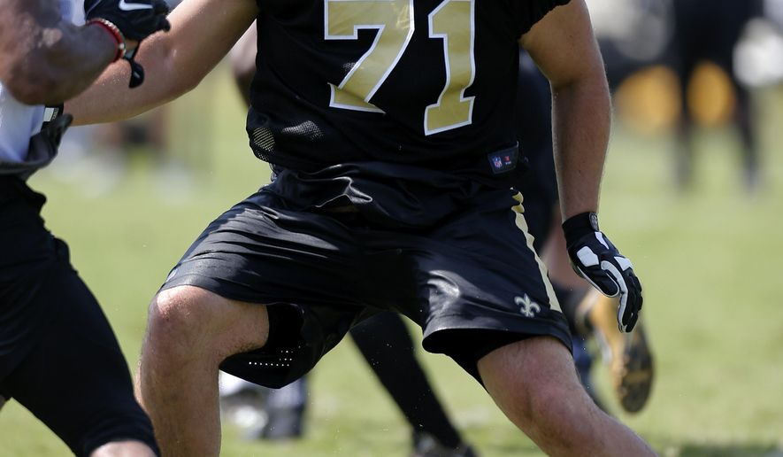 New Orleans Saints offensive tackle Ryan Ramczyk (71) runs a drill during an NFL football training camp in Metairie, La., Friday, July 28, 2017. (AP Photo/Jonathan Bachman)