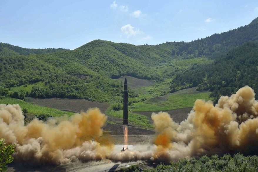 FILE- In this July 4, 2017 file photo, distributed by the North Korean government shows what was said to be the launch of a Hwasong-14 intercontinental ballistic missile in North Korea. North Korea fired a ballistic missile Friday night, July 28, which landed in the ocean off Japan, Japanese officials said. (Korean Central News Agency/Korea News Service via AP, File)