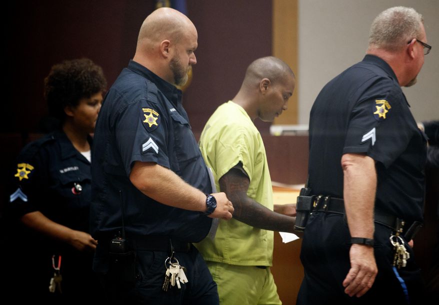 Former Omaha police officer Scotty Payne makes his first appearance in court Friday, July 28, 2017, in Omaha, Neb. Payne faces charges of second-degree assault related to the custody death of Zachary Bearheels. (Sarah Hoffman/The World-Herald via AP)