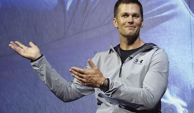 FILE - In this June 22, 2017, file photo, New England Patriots quarterback Tom Brady gestures during a promotional event in Tokyo. The Boston Globe and Fox News reported on Thursday, July 27, 2017, a search for “New York Jets owner” returned Brady as the top result. The glitch was fixed later in the day and Google declined comment on the issue. (AP Photo/Eugene Hoshiko, File)