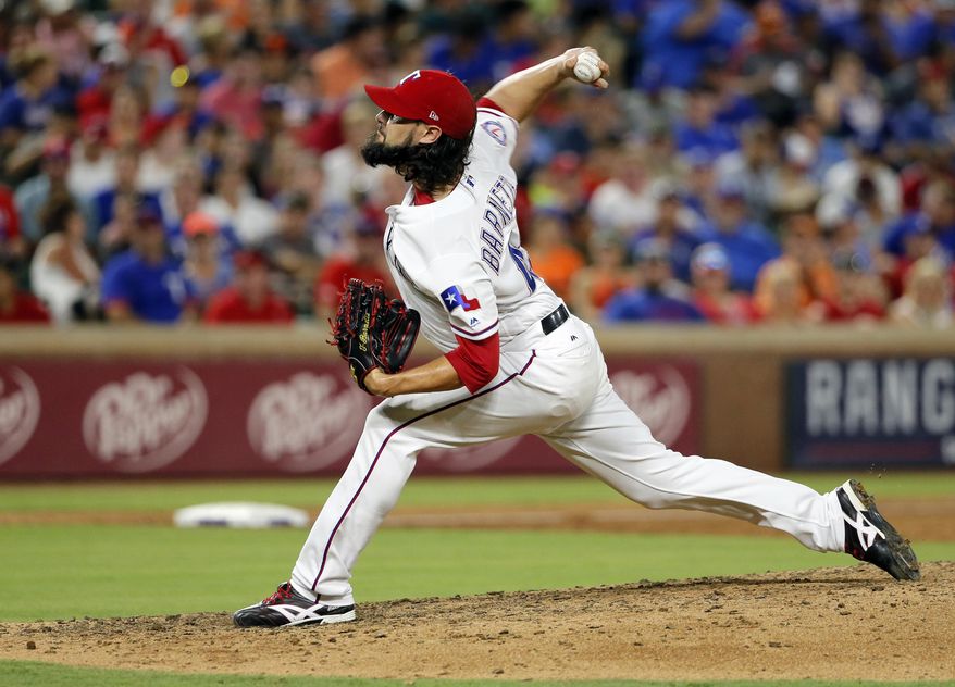 Texas Rangers relief pitcher Tony Barnette throws to the Baltimore Orioles in the seventh inning of a baseball game, Saturday, July 29, 2017, in Arlington, Texas. (AP Photo/Tony Gutierrez)